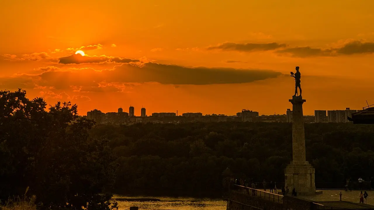a sunset over a city Belgrade, Kalemegdan fortress