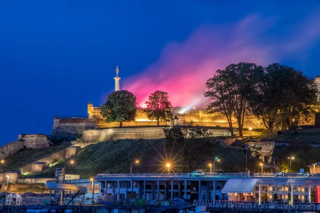 a building with a tower and a statue on top of it